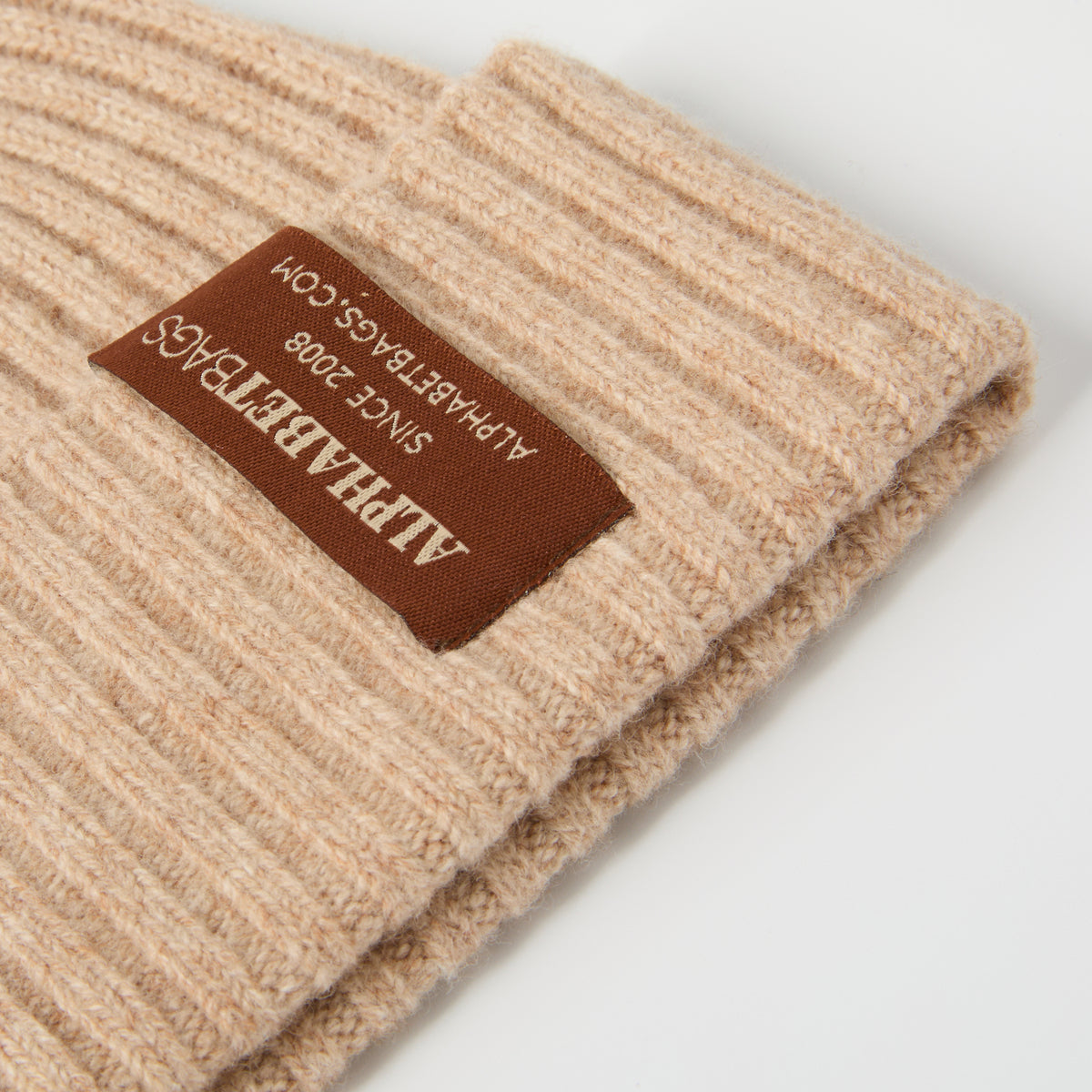 custom woven label on khaki merino wool beanie